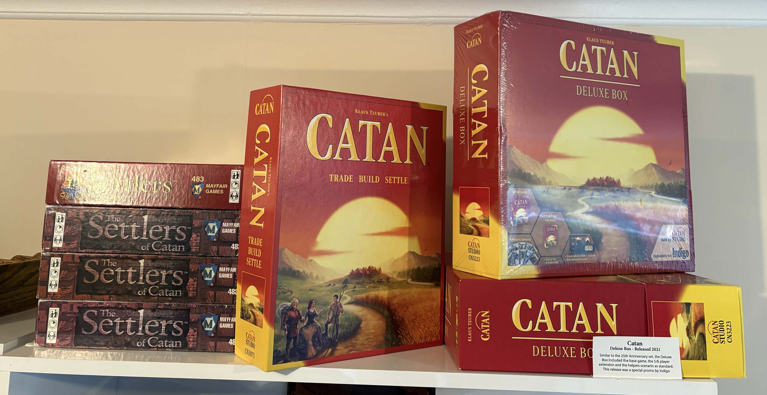 Shelf Six - On top of the display case<br>Play sets and Catan Deluxe Box Image